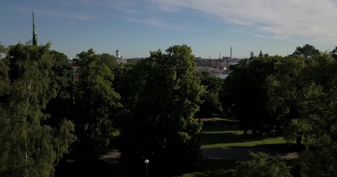 4K summer day aerial video of Helsinki Kaivopuisto central park with Observatory, ctyscape view, park woods area around it, in capital of Finland Suomi, northern Europe