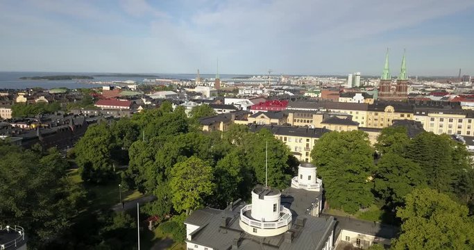4K summer day aerial video of Helsinki Kaivopuisto central park with Observatory, ctyscape view, park woods area around it, in capital of Finland Suomi, northern Europe