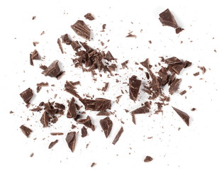 Chopped, milled chocolate pile with shavings isolated on white, top view