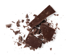 Chopped, milled chocolate pile with shavings isolated on white, top view