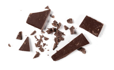 Chopped, milled chocolate pile with shavings isolated on white, top view