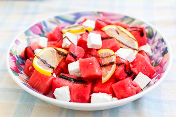 salad with watermelon, feta cheese, lemon and balsamic sauce