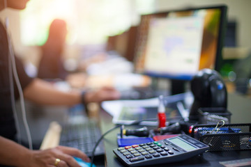 Business man using calculator with doing finance at his office.