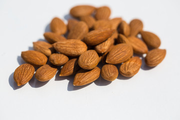 Apricot kernels on white background