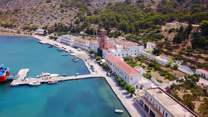 Fototapeta na wymiar Aerial bird's eye view photo taken by drone from bay and iconic Monastery of Panormitis, Symi island, Dodecanese, Greece