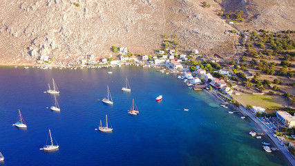 Aerial bird's eye view photo taken by drone of famous natural bay of Pedi, Symi island, Dodecanese, Greece
