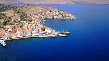 Fototapeta premium Aerial brid's eye photo taken by drone of Yalos, iconic port of Symi island, Dodecanese, Greece