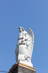 Obraz premium Shrine of Our Lady of Guadalupe. Silhouette of an angel sculpture against a cloudless sky