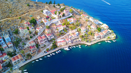 Aerial brid's eye photo taken by drone of Yalos, iconic port of Symi island, Dodecanese, Greece