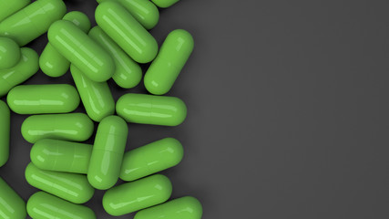 Pile of green medicine capsules