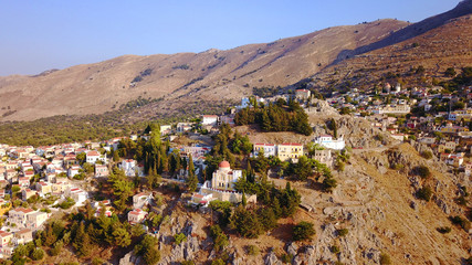 Obraz premium Aerial brid's eye photo taken by drone of Yalos, iconic port of Symi island, Dodecanese, Greece