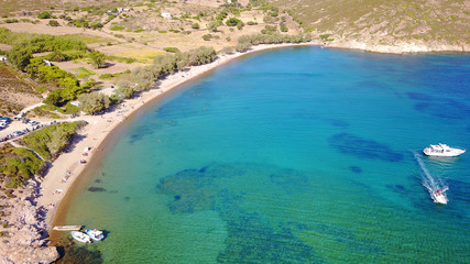 Fototapeta na wymiar Aerial bird's eye view photo taken by drone of famous rocky beach of Livadi Geranou with turquoise clear waters, Patmos island, Greece