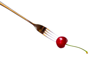 fresh red cherry blossom with green on a fork isolated on a white background - sweet eating, dessert and food concept