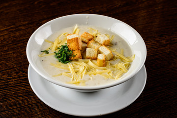 Cheese soup. Delicious soup with cheese and croutons in the whit
