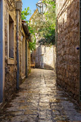 Old historical buildings in the narrow street at ancient city Budva, Montenegro