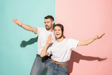 A couple of young man and woman dancing hip-hop at studio.