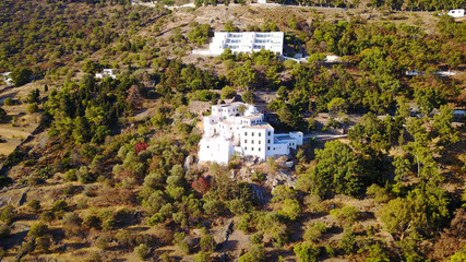 Aerial birds eye view photo taken by drone of Monastery of Saint John the Theologian where he wrote the book of Revelation, Patmos Island, Dodecanese, Greece