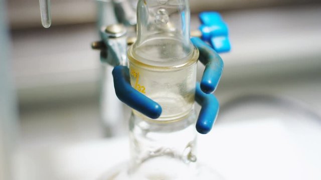 clear liquid flows down along bulb wall into oil fractions
