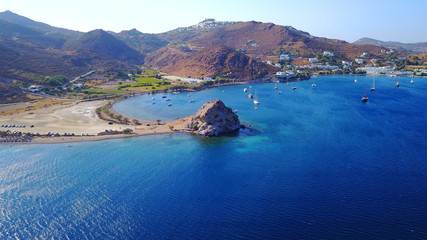 Fototapeta premium Aerial birds eye view photo taken by drone of famous rock of Kalikatsou in Petra beach, Patmos island, Dodecanese, Greece