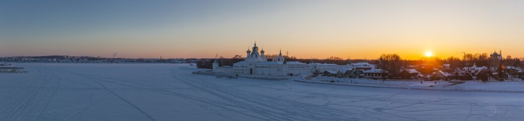 Fototapeta premium Russian Orthodox monastery in winter sunset
