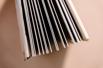 Photobooks in the cover of white leatherette, view from different sides