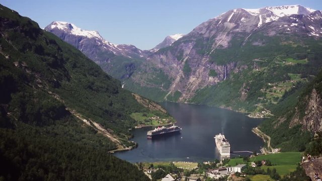 Geiranger fjord area, Norway. Aerial view at summer time. Fairytale landscape with its majestic, snow-covered mountain tops. Fantastic view of one of most beautiful tourist destinations in the world