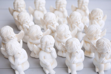 A little miniature statues angels with wings and halo.