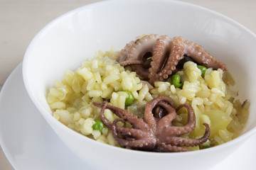 Rice with mini octopuses and green peas