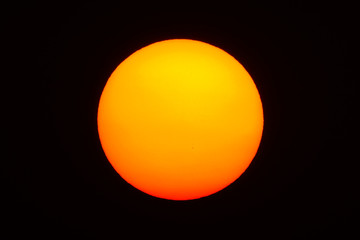 Isolate big red sun with black background