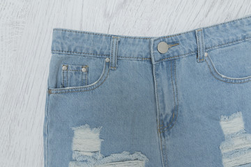 Ragged denim shorts. Close up. Fashionable concept.