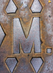Written Wording in Distressed State Typography Found Letter M