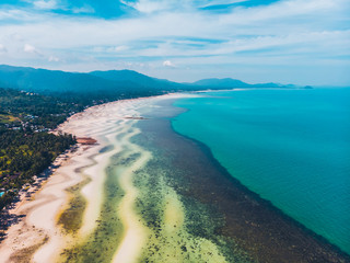 Aerial view of beautiful tropical beach and sea with trees on island