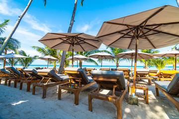 Umbrella and chair around beach and sea for travel and vacation