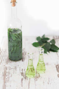 Herbal brandy with healty leafs