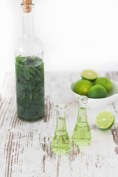 Herbal brandy with healty leafs and lime