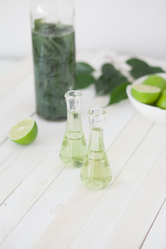 Herbal brandy with healty leafs and lime