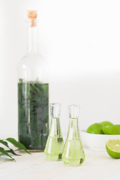 Herbal brandy with healty leafs and lime