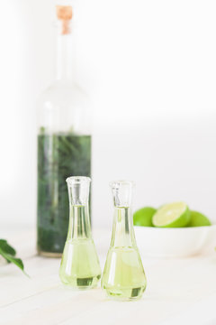 Herbal brandy with healty leafs and lime