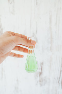 Closeup  hand holding glass of leaf brandy