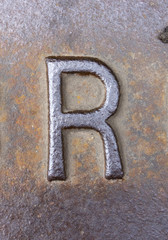 Written Wording in Distressed State Typography Found Letter R