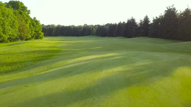 Raw drone footage of a golf course in beautiful nature