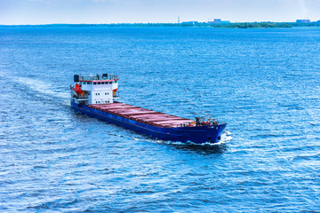 Large cargo ship in the blue sea