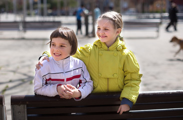 children posing outdoors in the spring