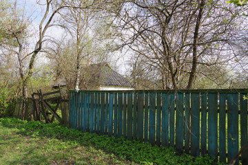 old rustic house outside the fence