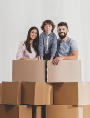 Family Moving to New Place and Stands with Boxes.