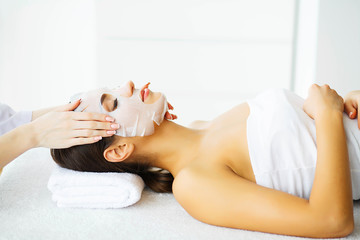 Obraz premium Beauty. Woman in the Beauty Salon with Mask for Face. Lying on the Massage Tables with Closed Eyes. Clean and Fresh Skin. Skin Care. High Resolution