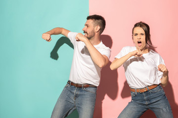 A couple of young man and woman dancing hip-hop at studio.