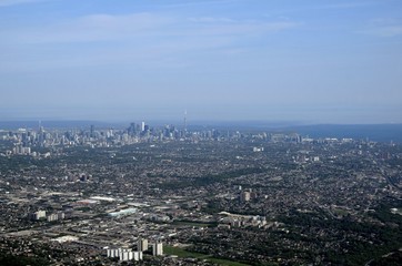 Fototapeta na wymiar Toronto aerial view of the dense urban downtown area in the background