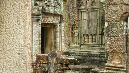 Fototapeta na wymiar Historic Angkor Wat temple complex fading in a remote part of rural Cambodia.
