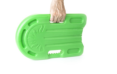 Green safety plastic swim board in hand  on the white